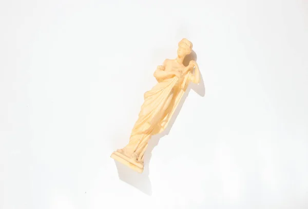 Figurine Ancient Goddess White Background Photo Shadows Hard Light Top — Stock Photo, Image