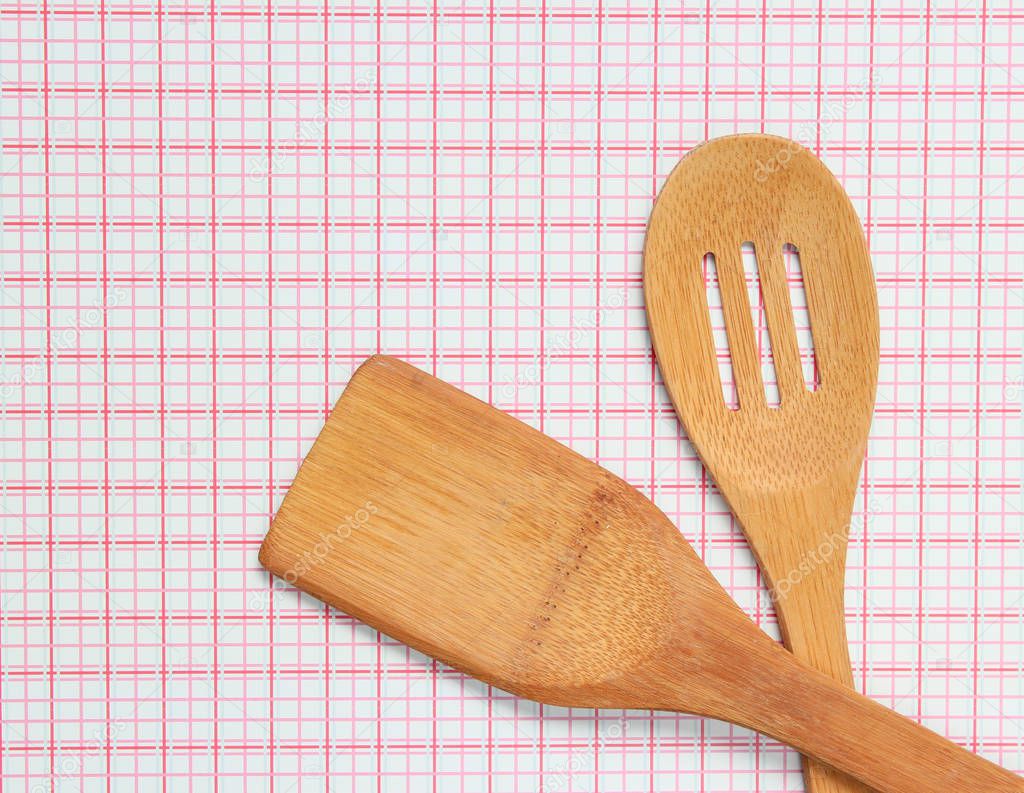 Wooden spatula for cooking on a tablecloth, top vie