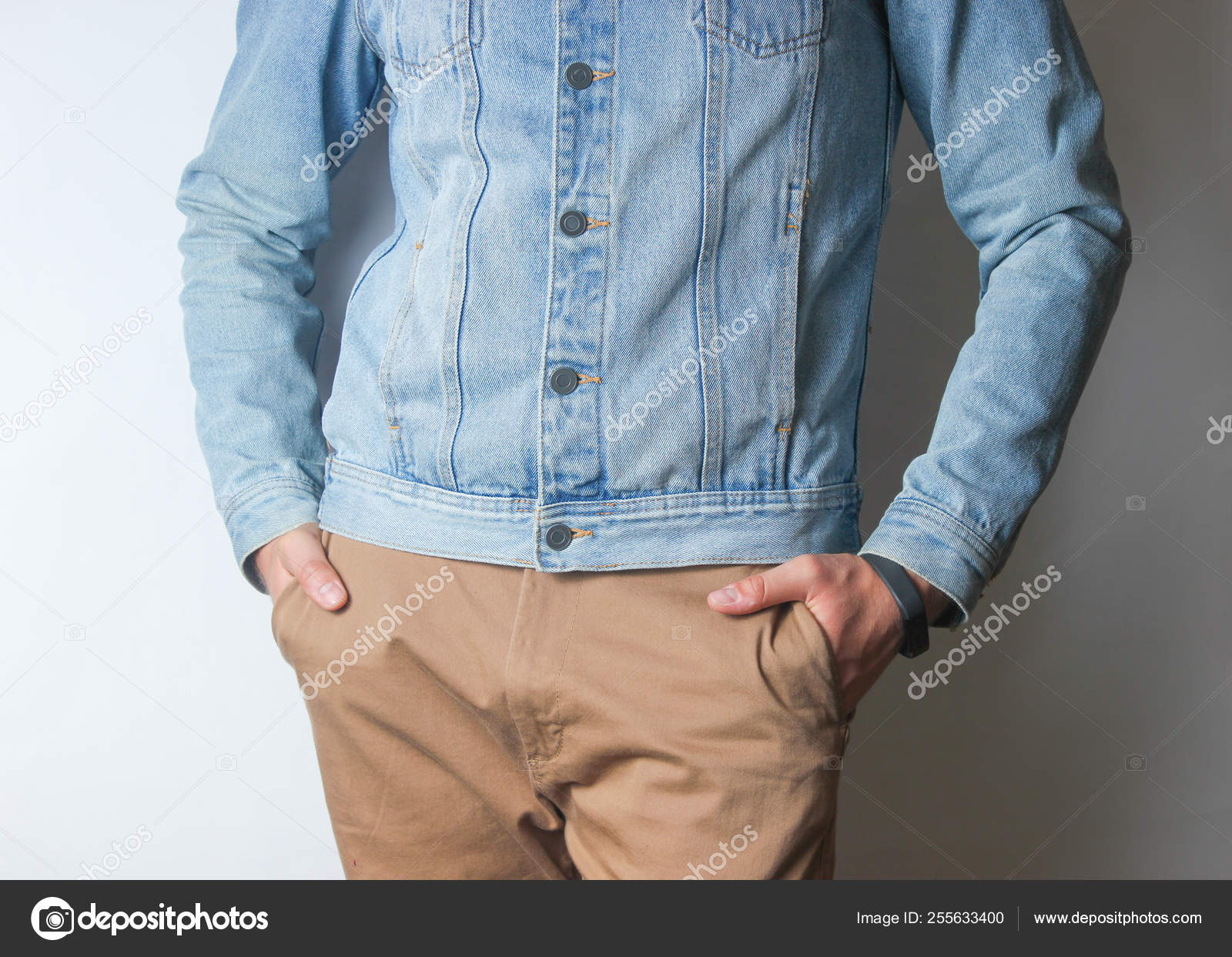 jean jacket with tan pants