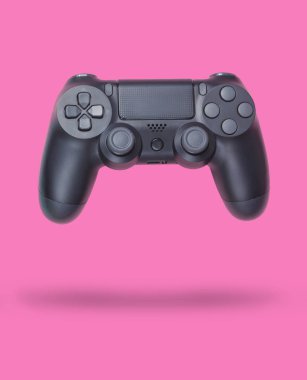 Pembe pastel kağıt arka plan üzerinde Gamepads. Üst te. Minimalizm