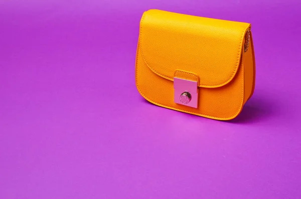 Yellow Leather Mini Bag Metal Lock Purple Background — Stock Photo, Image