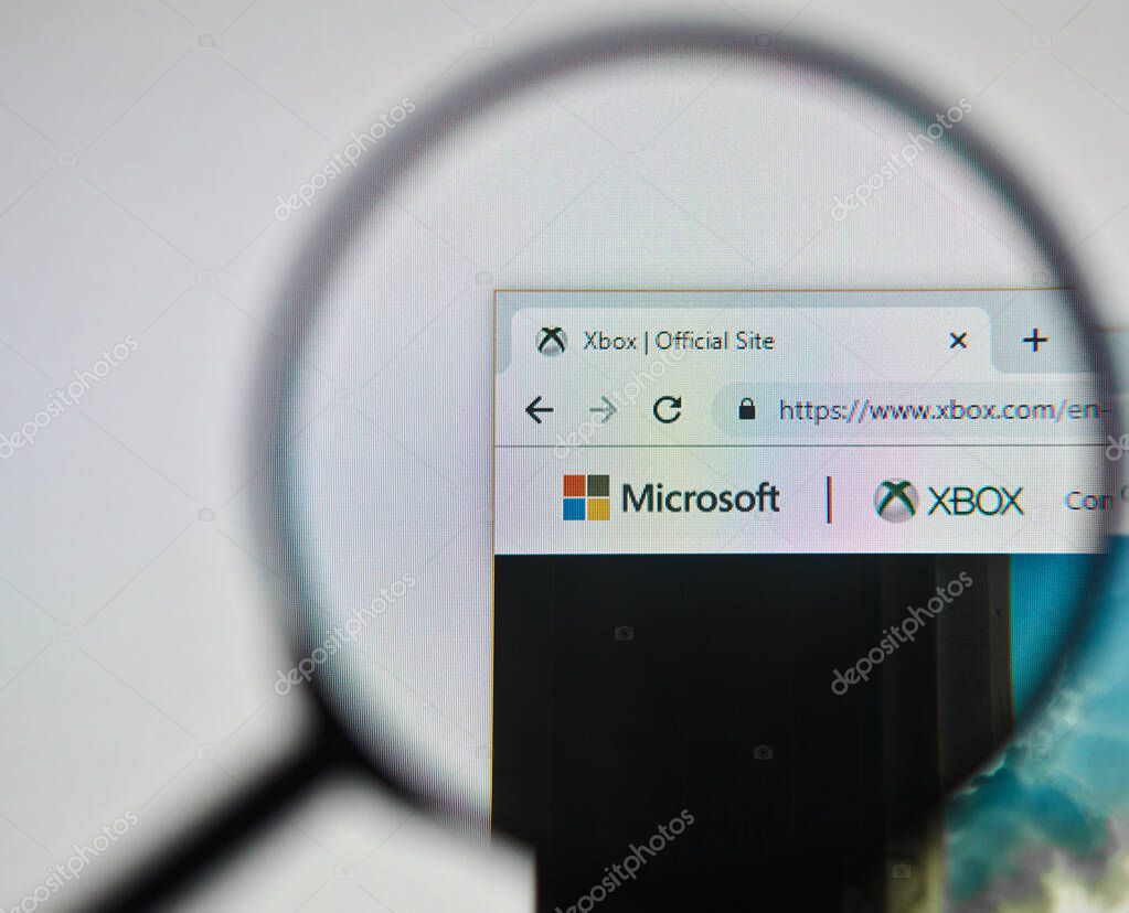 UKRAINE, ODESSA - APRIL 25, 2019: Microsoft xbox website logo through magnifying glass