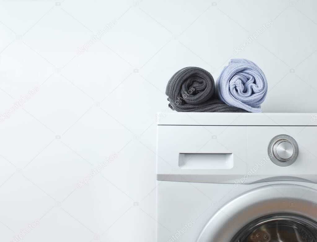 Rolled sweaters on the washing machine