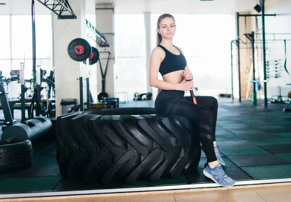 Fitness Blonde Woman Sitting Big Black Wheel Funcional Training Holding — Stock Photo, Image