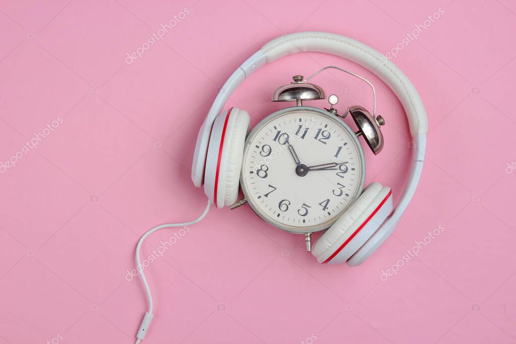 Creative Concept Retro Alarm Clock And Classic Headphones On Pink Background Pop Culture 80s Top View 387998662 Larastock Creative Concept Retro Alarm, Pink Retro Alarm Clock