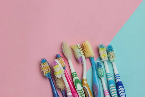 Lot Old Used Toothbrushes Blue Pink Pastel Background Top View — Stock Photo, Image