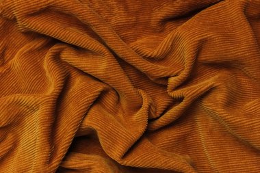 Buruşmuş turuncu kadife kumaş dokusu. Buruşuk Arkaplan