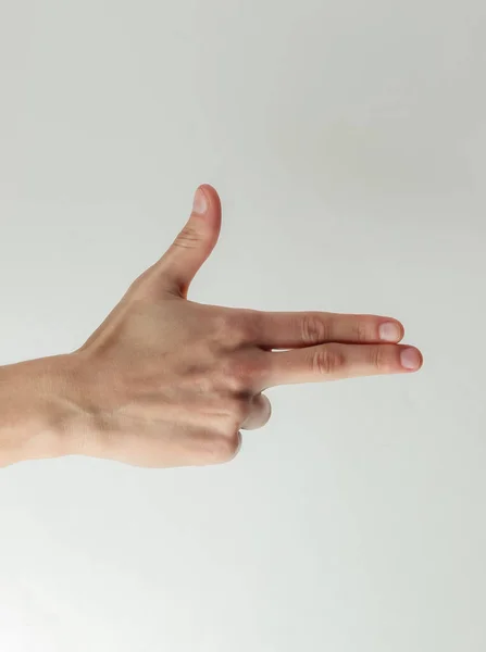 Vrouwelijke Hand Toont Een Pistool Gebaar Een Witte Achtergrond — Stockfoto