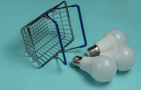 Three Led Light Bulbs Shopping Basket Blue Background — Stock Photo, Image