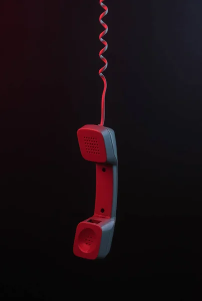 Słuchawka Czarnym Tle Neonowym Czerwonym Światłem — Zdjęcie stockowe