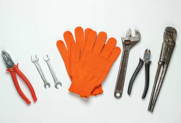 Set of professional work tools on a white background. Top view
