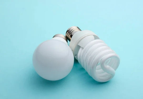 Energy Saving Light Bulb Close Blue Pastel Background — Stock Photo, Image