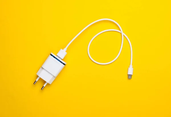 Charger Cable Yellow Background Top View — Stock Photo, Image