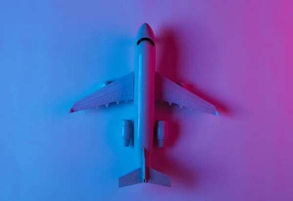 Airplane Figurine Neon Blue Pink Light Top View — Stock Photo, Image