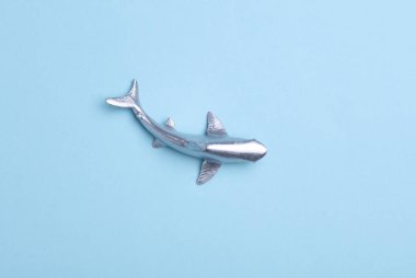Toy shark on a blue background