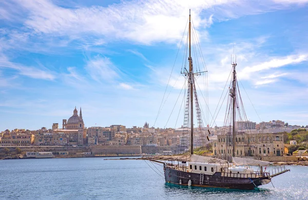 Malta, Valletta, the ancient architectures of the city seen from the sea with  an ancient sailing ship in the foreground
