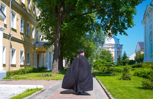 Sergiyev Posad, Russia - July 14, 2015: An  orthodox priests in the Trinity Monastery of St. Sergius