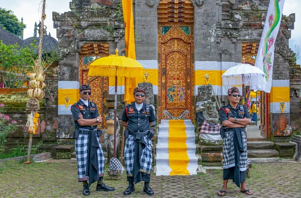 Bali, Indonesia - March 24, 2017:  Military police overseers in the Ulun Danu temple on  the Beratan lake riverside