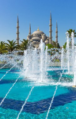Istanbul, the Sultan Ahmed mosque (Blue Mosque) seen from the Sultanahmed square fountain clipart