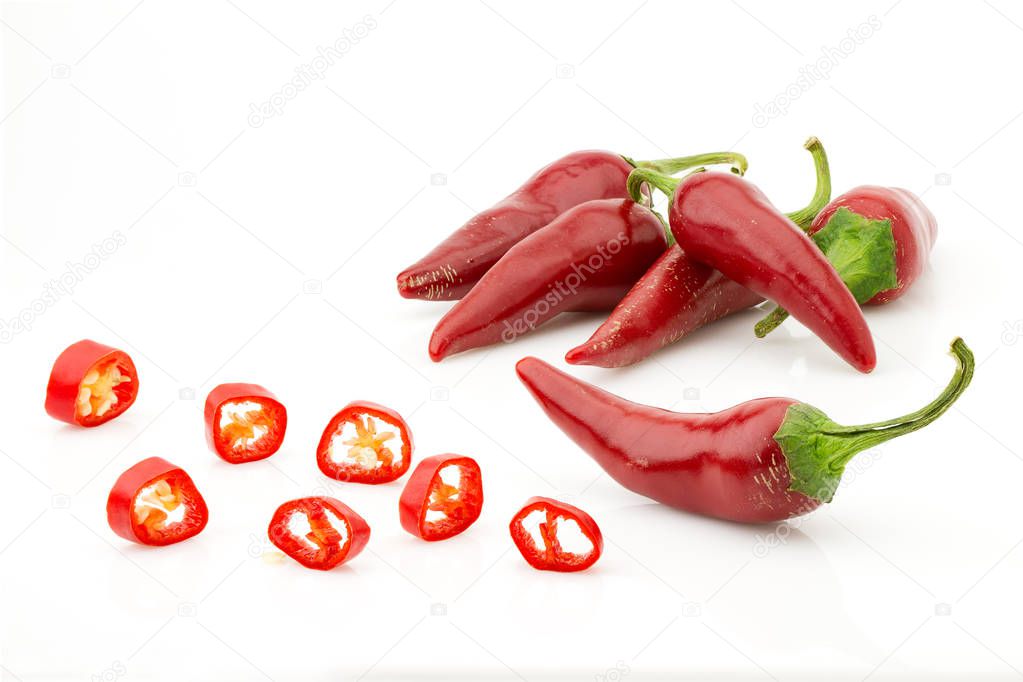 chopped red chilli pepper or chilli cayenne pepper close up, isolated on white background