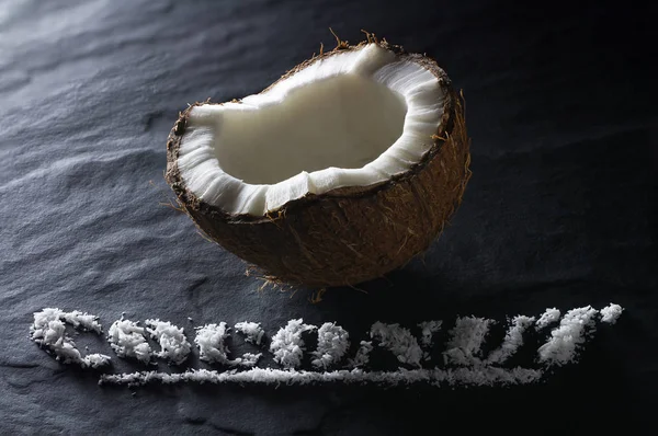 Half Ripe Coconut Close Black Textural Background — Stock Photo, Image