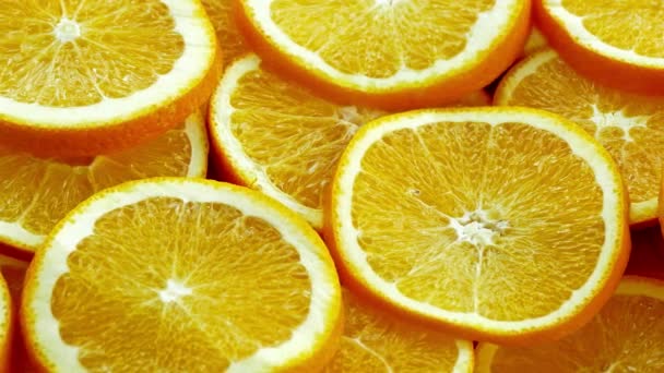 许多切片新鲜橙子 柑橘背景 — 图库视频影像