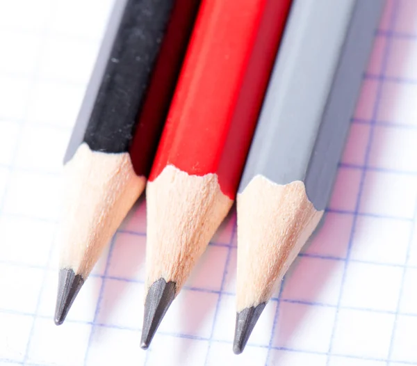 Red and black drawing crayon isolated on white background