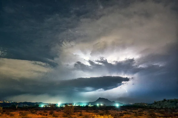 Lightning and monsoon storms over Red Mountain in the Tonto National Forest near Phoenix, Arizona.