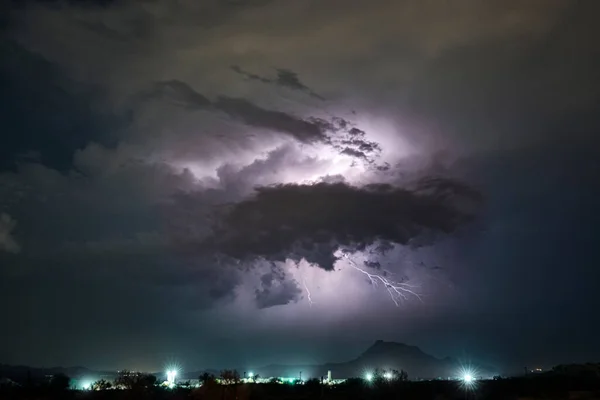 Lightning and monsoon storms over Red Mountain in the Tonto National Forest near Phoenix, Arizona.