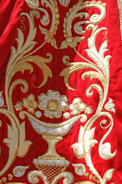 Golden and red virgin mantle. 
