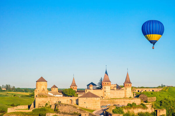 Ancient medieval Kamianets-Podilskyi castle with balloons.