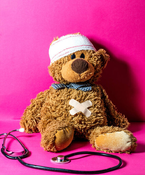 injured child's teddy bear with a belly and head