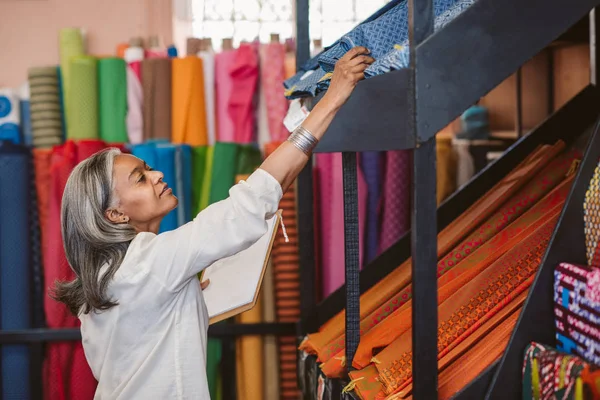 Mature Fabric Shop Owner Working Her Store Surrounded Colorful Cloths — Stock Photo, Image