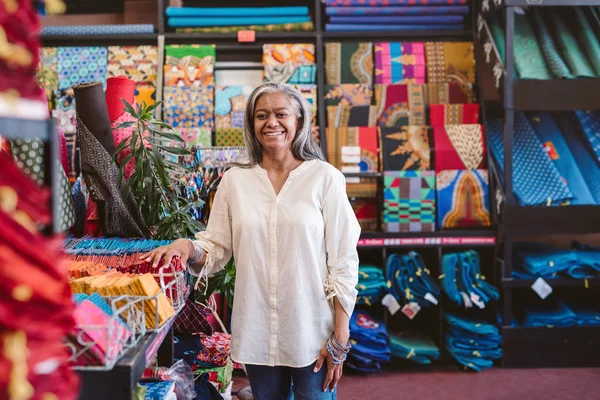 Portrait Smiling Mature Fabric Shop Owner Standing Racks Shelves Full — Stock Photo, Image