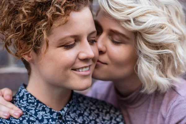 Closeup Young Woman Affectionately Kissing Her Smiling Girlfriend Cheek While — Stock Photo, Image