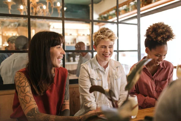 Smiling Group Diverse Young Female Friends Laughing Talking Together While — Stock Photo, Image