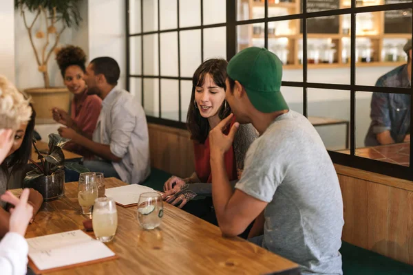 Young Man Woman Talking Each Other Having Drinks While Sitting — Stock Photo, Image