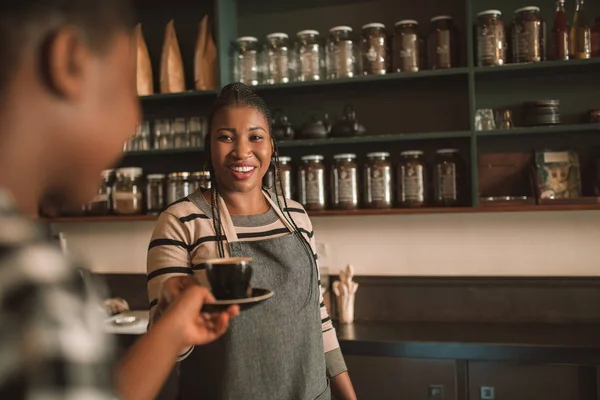 Smiling Young African Barista Handing Cup Freshly Made Cappuccino Customer — Stock Photo, Image