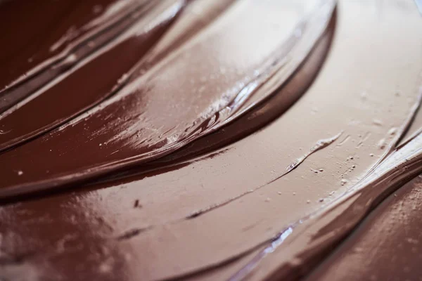 Closeup Glistening Melted Chocolate Spread Out Table Artisanal Chocolate Making — Stock Photo, Image