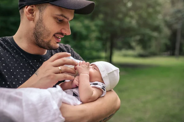 Loving Young Father Holding His Baby Boy His Arms Feeding — Stock Photo, Image