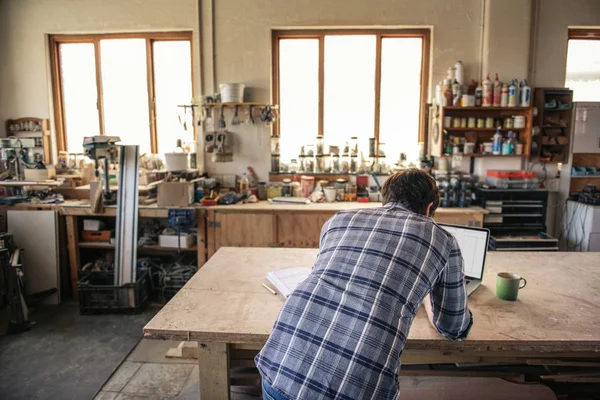 Rearview Woodworker Leaning Bench His Carpentry Studio Drinking Coffee Working — Stock Photo, Image