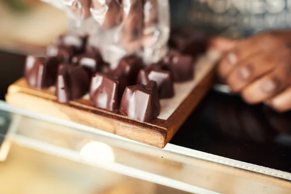 Closeup Chocolatier Arranging Small Pieces Chocolate Serving Board Display Counter — Stock Photo, Image