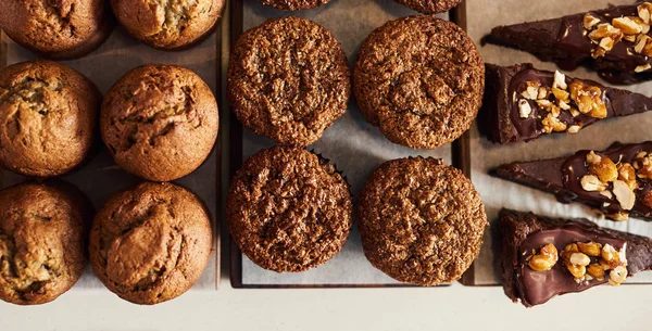 High Angle Assortment Delicious Looking Muffins Chocolate Pie Slices Sitting — Stock Photo, Image