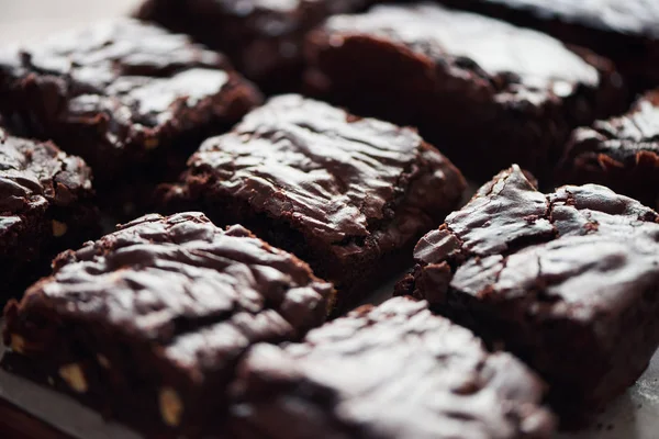 Closeup Delicious Looking Pile Freshly Baked Chocolate Brownies Cooling Table — Stock Photo, Image