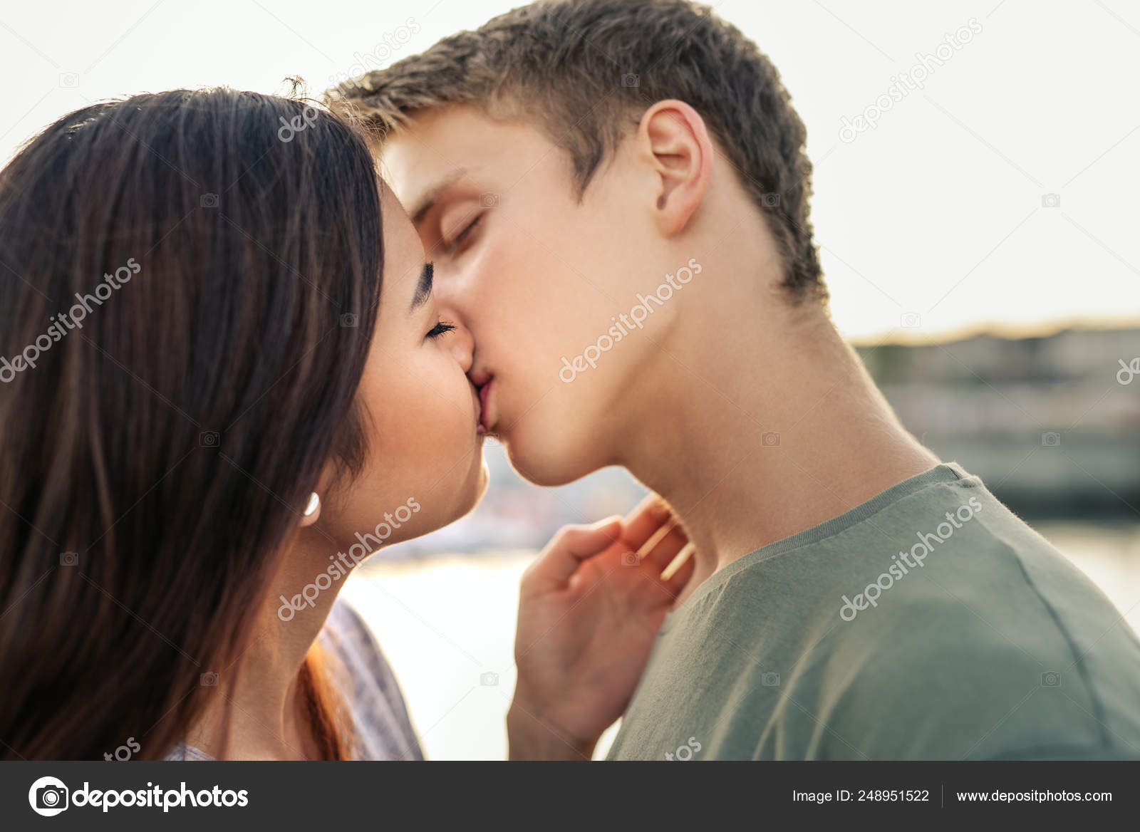 Affectionate Young Couple Sharing Romantic Kiss While Standing Arm Arm Stock Photo Image By C Mavoimages Affectionate Young Couple Sharing Romantic Kiss While Standing Arm Arm Stock Photo Image By C Mavoimages