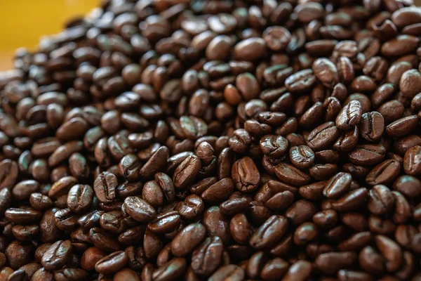 Close up of best quality roast coffee beans import from local farm for brew the pure coffee shot to make variety of beverage.