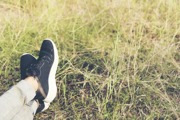 Life is journey, Black sneaker on the grasses. Travel Concept.