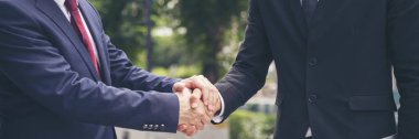 Banner Lawyer teamwork partnership Businessman handshake together. Panorama Two Men Trust honesty lawfirm business handshake promise respect partner. Diversity solidarity team Partner hands together