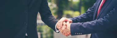 Banner Lawyer teamwork partnership Businessman handshake together. Panorama Two Men Trust honesty lawfirm business handshake promise respect partner. Diversity solidarity team Partner hands together