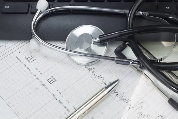 Stethoscope on the keyboard illustrating the medical industry / Medical information concept